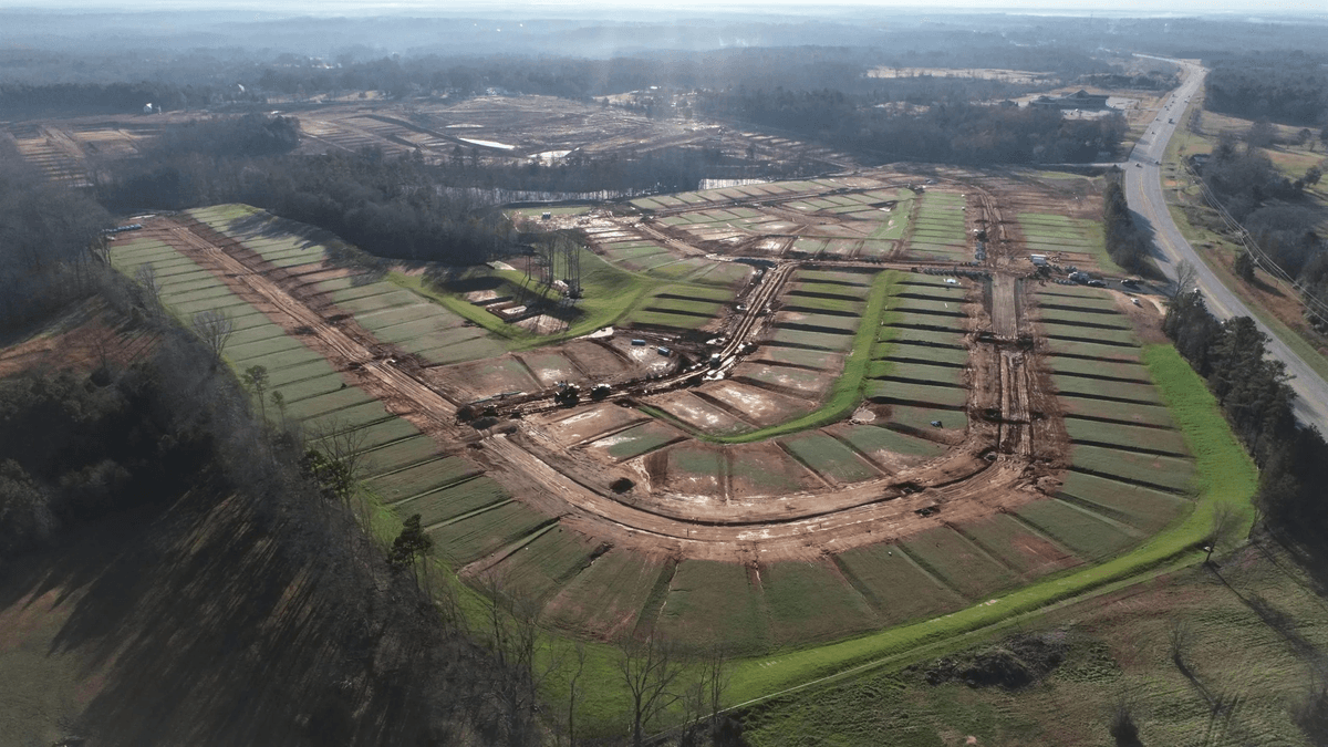 Aerial view of an active GPS-guided construction grading site